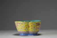 China - A pink family polychrome porcelain bowl decorated with an Imperial dragon on a yellow background, Tao Kuang mark and period.