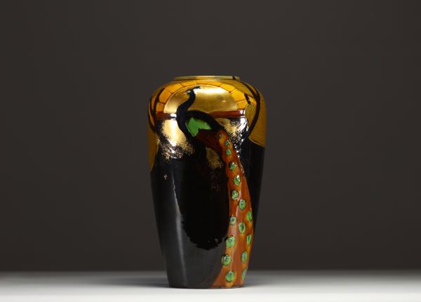 Art Nouveau porcelain vase decorated with a peacock.