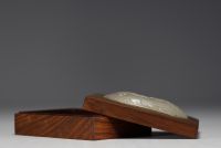 China - Wooden box surmounted by a white jade medallion carved with a mage design (18th century jade)
