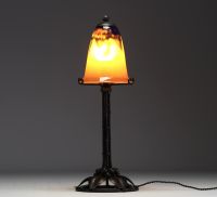 DAUM Nancy - Art Nouveau lamp in forged metal with plant decoration, globe in translucent coloured glass, signed.