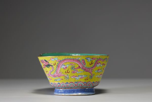 China - A pink family polychrome porcelain bowl decorated with an Imperial dragon on a yellow background, Tao Kuang mark and period.