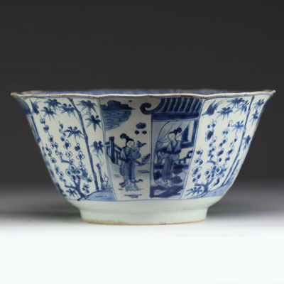 China - Large blue-white porcelain bowl with floral decoration and figures, Kangxi.