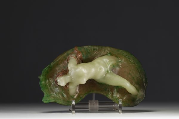 Amalric WALTER (1870-1959) - Sculpture in pink and green glass paste in high relief depicting a young girl lying in the waves, signed.