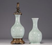 China - A celadon porcelain oil lamp and shaft decorated with flowers and bamboos, 18th-19th century.