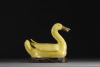 China - Yellow porcelain duck on wooden base, Qing period.