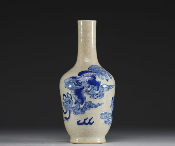 China - A 19th century Nanking porcelain vase decorated with Fô dogs on a crackled background.