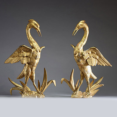 Paire d'échassiers en bois sculpté doré, éléments décoratifs du XIXème.