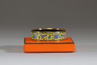 Hermès - Bracelet en plaqué or et émail imprimé à décors de vignes, dans son écrin d'origine, signé.