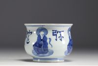 China - White and blue porcelain brush with sage decoration.