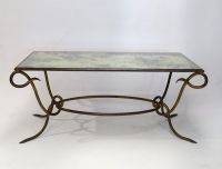 René DROUET (1899-1993) Gilded wrought iron coffee table with eglomised glass top, circa 1940