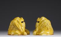 Asian- Pair of yellow porcelain figurative incense burners depicting dogs.