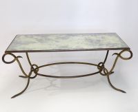 René DROUET (1899-1993) Gilded wrought iron coffee table with eglomised glass top, circa 1940
