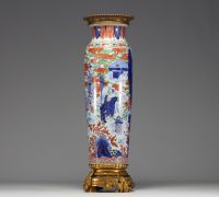 China - A polychrome porcelain vase with cloudy landscape and figures on a bronze frame, Transition period, 17th century.