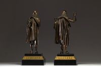 ‘Molière and Corneille’ Pair of bronze sculptures with brown patine on black marble base and gilded bonze, 19th century.