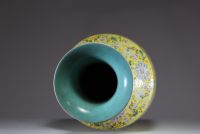 China - Imposing pink family polychrome porcelain vase with floral decoration on a yellow background, handles depicting dragons, 20th century.