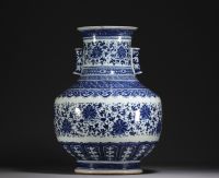 China - Large Hu-shaped vase in blue-white porcelain with floral decoration and bamboo handles, 19th century