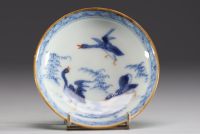 China - Set of four polychrome porcelain bowls and plates with floral decoration and ducks.18th