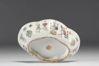 China - Famille rose polychrome porcelain bowl decorated with furniture, circa 1920.