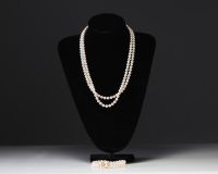 Two strands of cultured pearls, necklace and bracelet, 18k gold clasps.