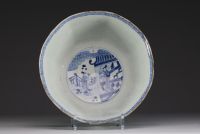 China - Large blue-white porcelain bowl with floral decoration and figures, Kangxi.