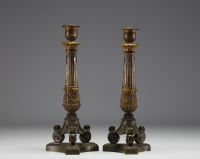 Paire de bougeoirs en bronze à double patine d'époque Charles X.