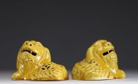 Asian- Pair of yellow porcelain figurative incense burners depicting dogs.