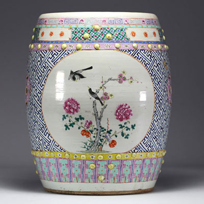 China - A famille rose porcelain stool decorated with peonies and birds in cartouches, circa 1900