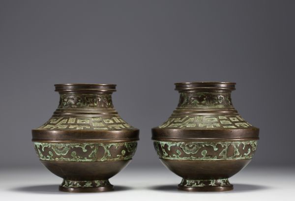 China - Pair of bronze vases decorated with Fô dogs, debossed mark under the pieces.