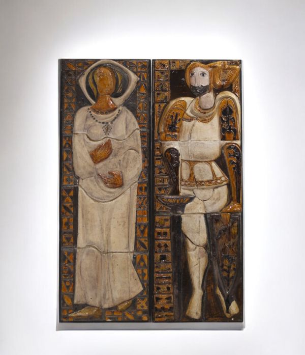 Pair of imposing glazed ceramic bas-relief figures, circa 1950-60.