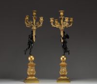‘Amour et Psyché’ Elegant pair of candelabra in chased gilt bronze with black patina, from the Empire period.