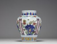 China - A 19th century polychrome porcelain vase with floral decoration.